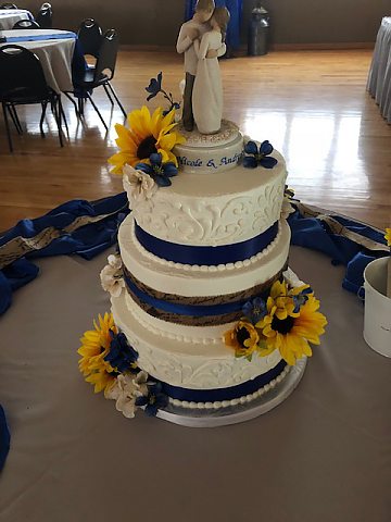 3 tier buttercream scrolls navy with sunflower